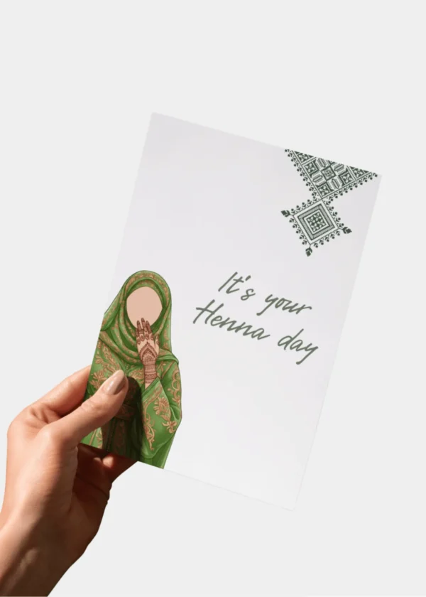 Hand houdt feestelijke henna dag kaart vast met tekst It's your Henna day